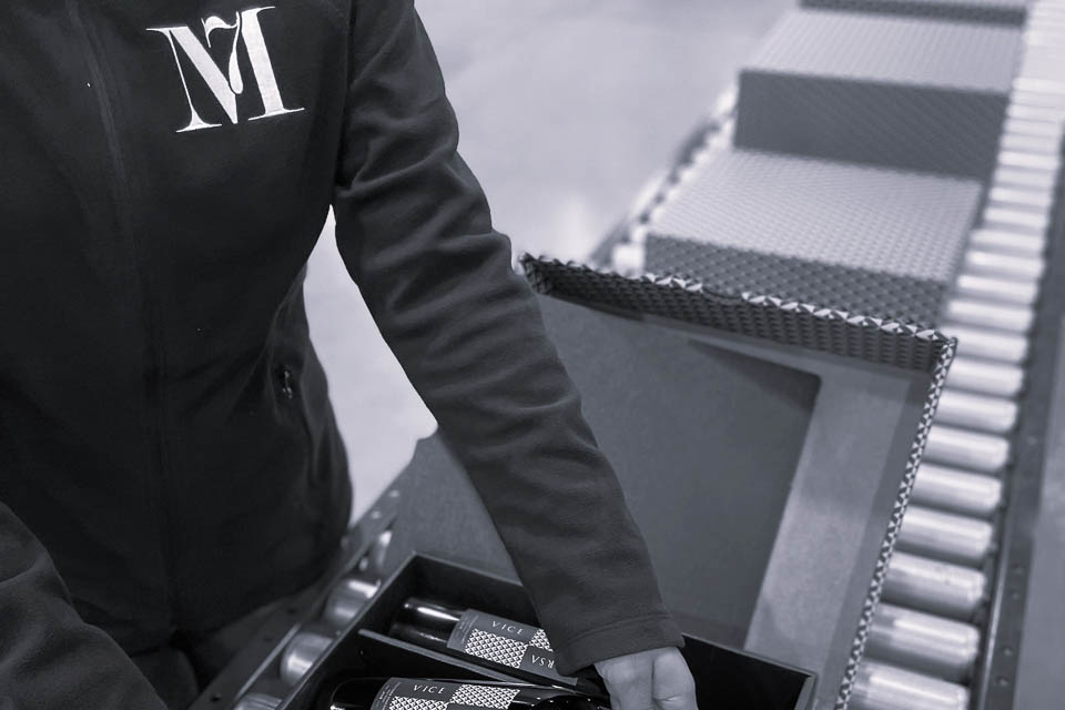 Employee boxing wine for shipping